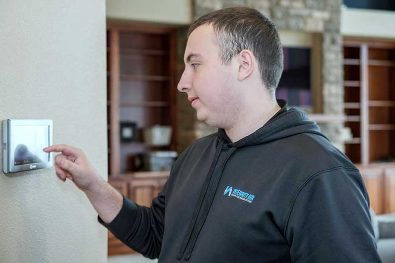 Integrity Tech helping homeowner with heat pump repair