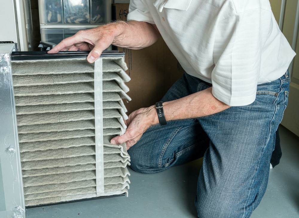 Replacing HVAC filter as part of seasonal maintenance